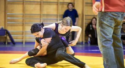 Two athletes wrestle 