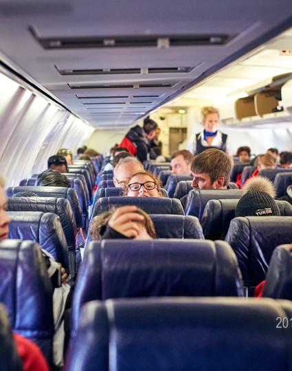 Yukon athletes find their seat on an Air North flight.