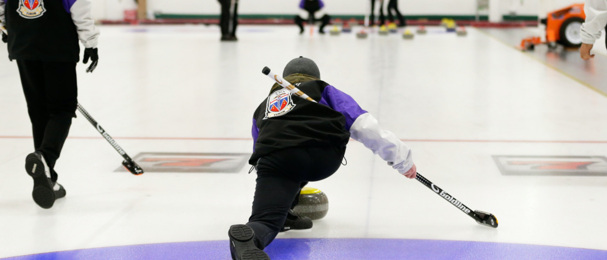 A Team Yukon curler leaves the hack