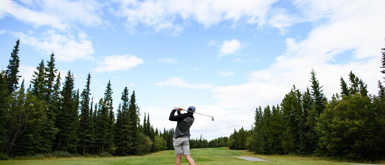 A golfer tees off at the Mountain View Golf Club