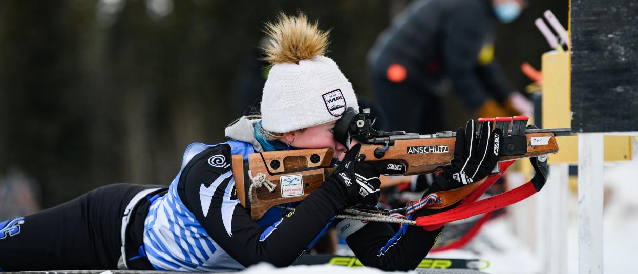 A biathlete prepares to shoot.