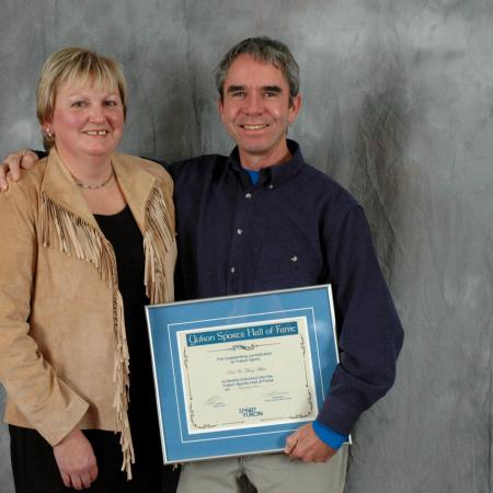 Marg and Don White accept their Hall of Fame plaque in 2004.