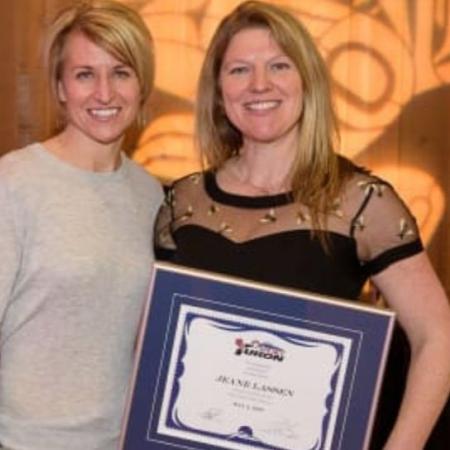 Jeane Lassen accepts her Hall of Fame award from Tracey Bilsky.